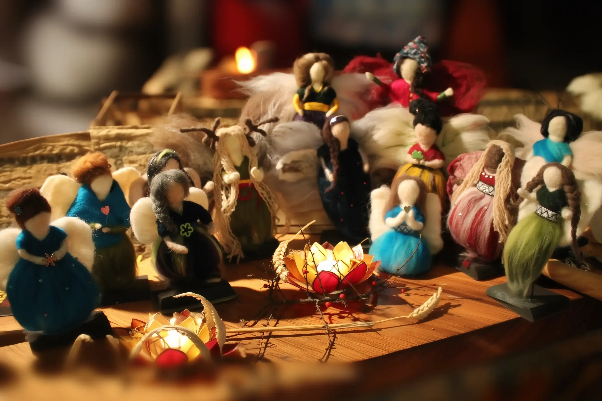 MariaElena | Diverse handmade felted angels gathered around warm lantern light, each with unique personality and design