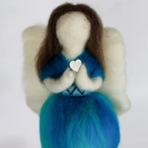 MariaElena | Handmade needle felted angel in ocean blue and teal wool holding white heart at chest with cream wings and dark brown hair