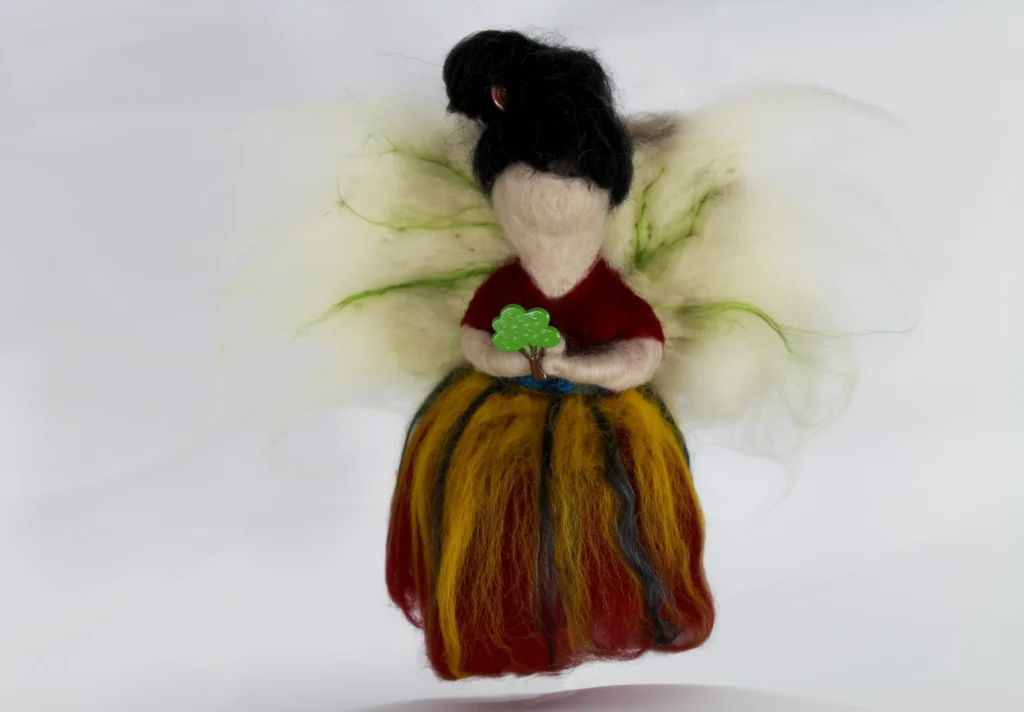 MariaElena | Handmade felted angel with black hair and golden flowing skirt holding small green tree, Guardian of the Inner Garden memorial angel by Maria